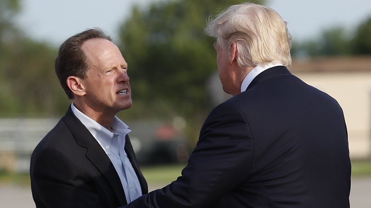 Sen. Pat Toomey, R-Pa., is shown greeting President Donald Trump at Harrisburg International Airport in Middletown, Pa., in April. (AP Photo/Carolyn Kaster) 