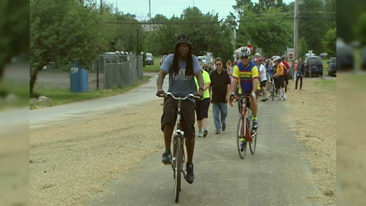 Cyclists take the first ride on the new trail connecting Delaware City to the C&D Canal Trail. (Charlie O'Neill/WHYY)
