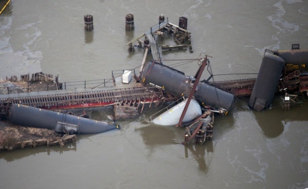 <p><p>Several cars lay in the water after a freight train derailed in Paulsboro, N.J. (AP Photo/Cliff Owen)</p></p>

