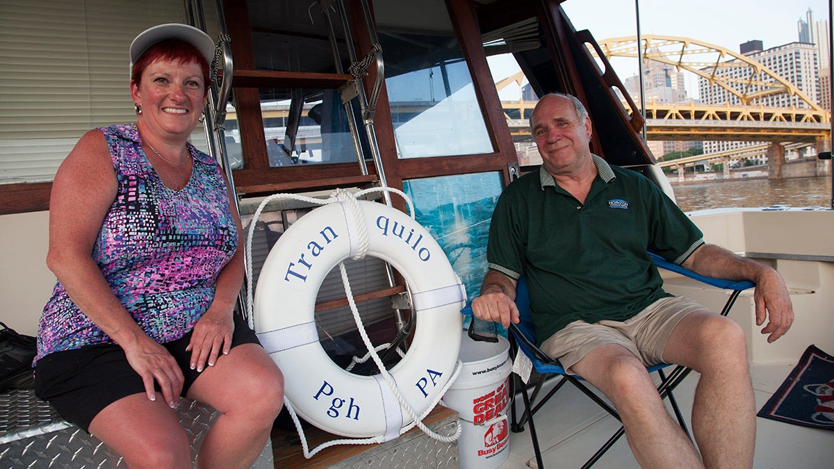  Dan Hennessy (right) and Jane McGrane boat, swim, and fish in Pittsburgh's rivers. Hennessy said he watched the waterfronts transform, starting with the Point, from industrial areas to more accessible public spaces. (Irina Zhorov/WESA)   