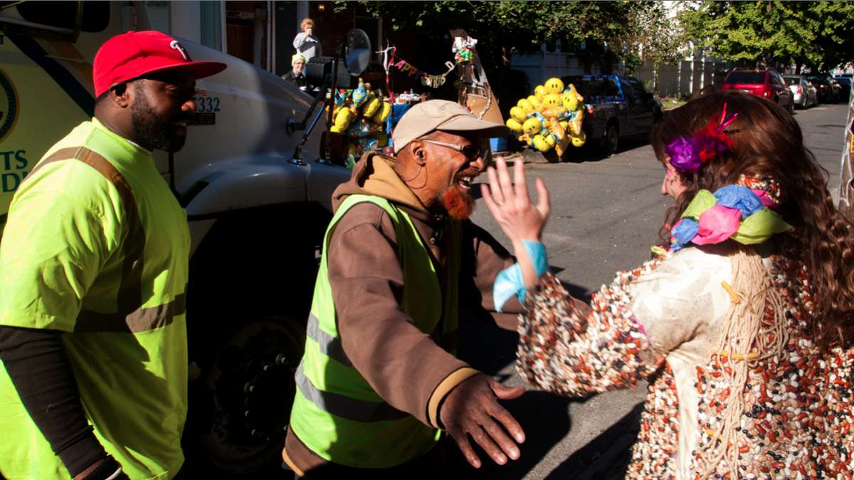 Soxx hugs Redbeard at Happy Trash Day in East Kensington. (Brad Larrison/for NewsWorks)