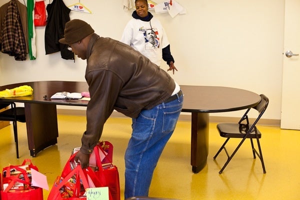 <p><p>Bernard Rivers lends a hand before taking away his own donated turkey as event coordinator Darlene Voykin looks on at Triumph Baptist Church on Germantown and Hunting Park Avenue Saturday. (Brad Larrison/for NewsWorks)</p></p>
