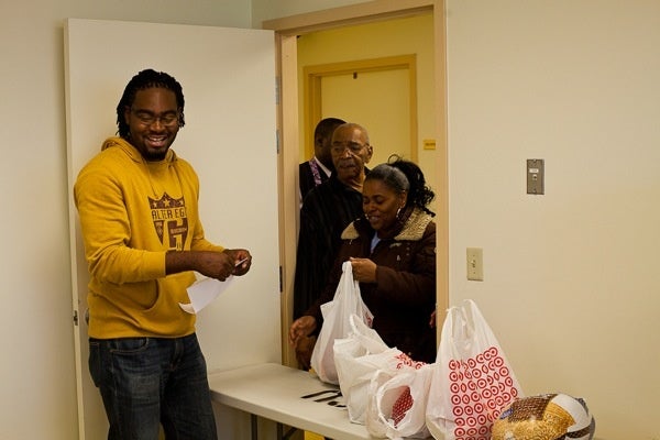 <p><p>Brandon Vaughan ran the table where residents could pick up a turkey. (Brad Larrison/for NewsWorks)</p></p>
