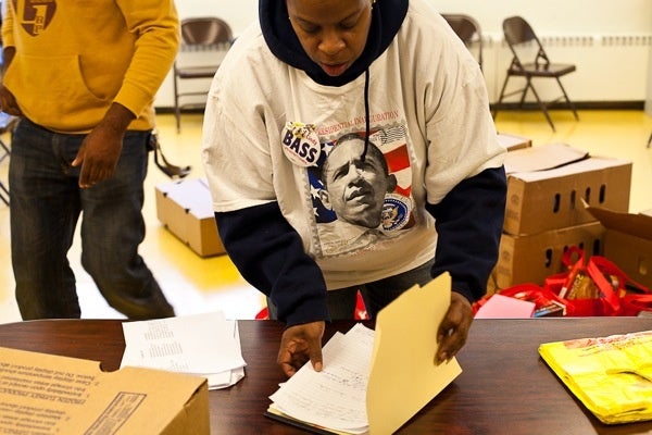 <p><p>Event coordinator Darlene Voykin keeps things organized as families arrive to pick up their turkeys. (Brad Larrison/for NewsWorks)</p></p>
