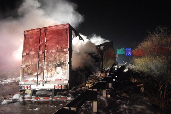 <p><p>The smoldering remains of a tractor trailer sit along the shoulder on I-495. (John Jankowski/for NewsWorks)</p></p>
