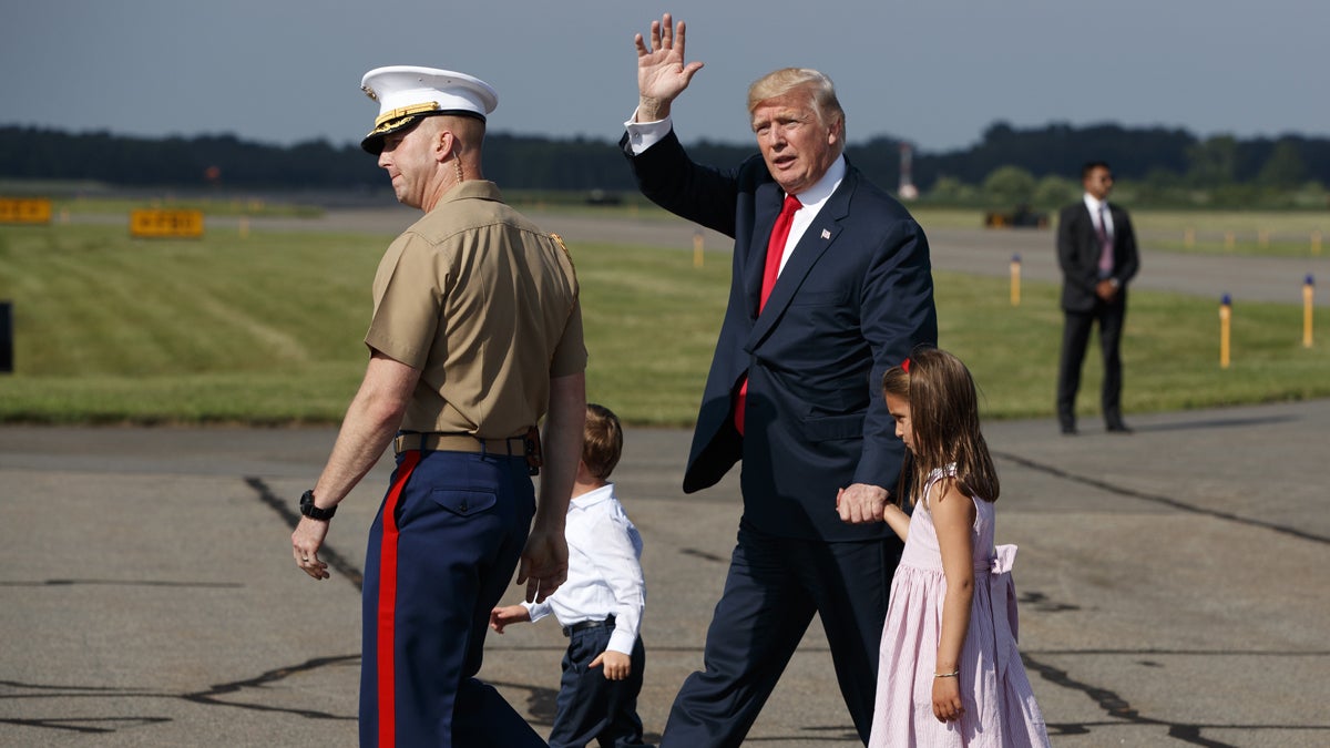  President Donald Trump waves after arriving at Morristown Municipal Airport with his grandchildren, Arabella Kushner, right, and Joseph Kushner to begin his summer vacation at his Bedminster golf club, Friday, Aug. 4, 2017, in Morristown, N.J. (AP Photo/Evan Vucci) 