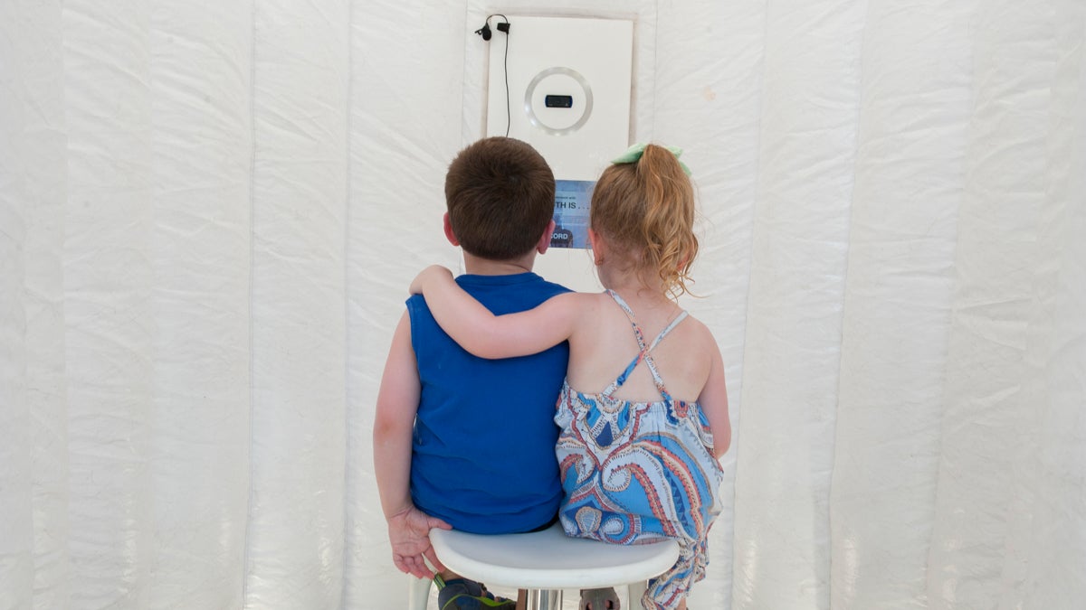 Youngsters prepare to be recorded in the Truth Booth. (Jonathan Wilson for Newsworks)