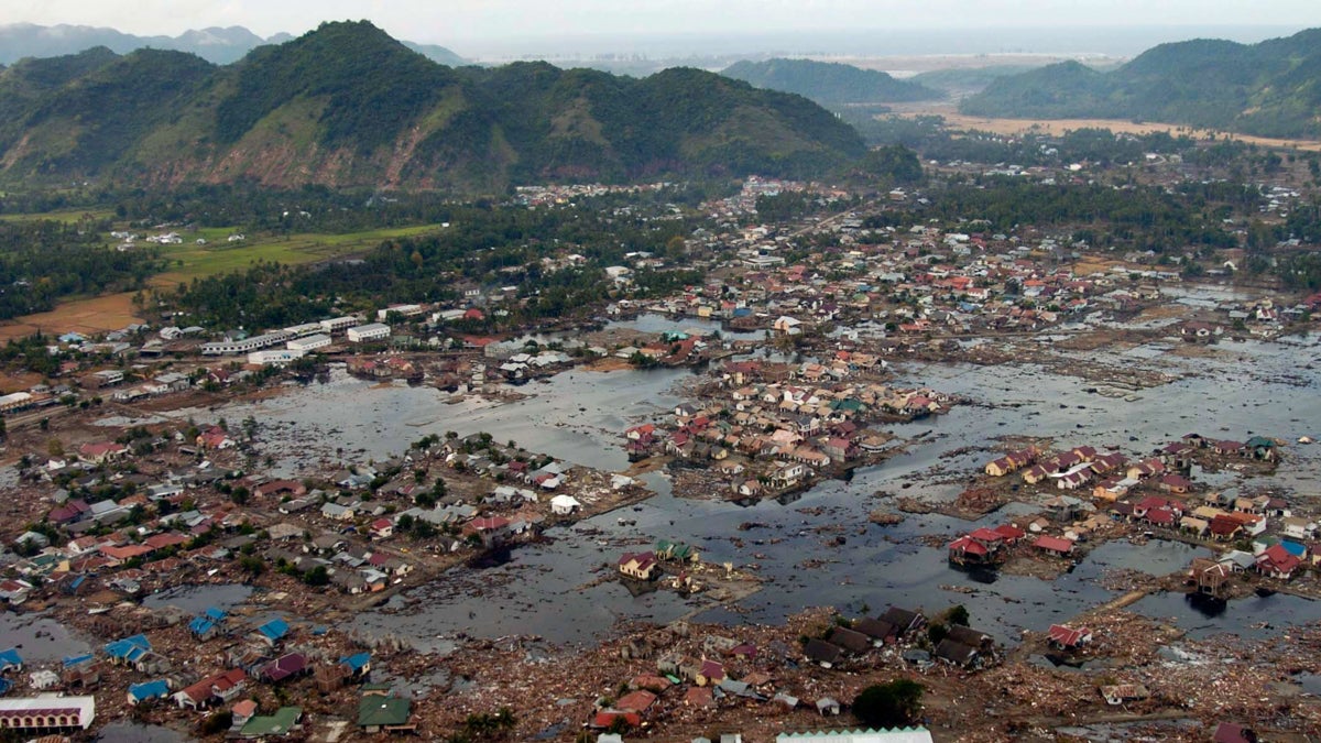  A village near the coast of Sumatra lays in ruin after the Tsunami that struck South East Asia. (<a href=