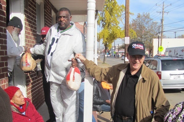 <p><p>Volunteers pass donated turkeys down the line. (Mark Eichmann/WHYY)</p></p>
