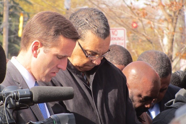 <p><p>Delaware Attorney General Beau Biden bows for prayer alongside Wilmington Mayor James Baker. (Mark Eichmann/WHYY)</p></p>
