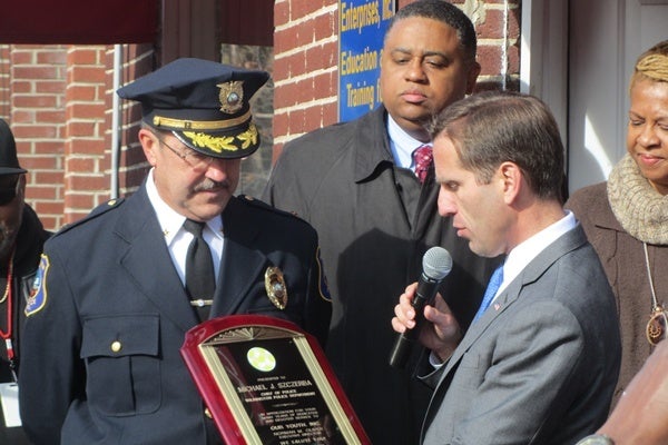 <p><p>Delaware AG Beau Biden reads a plaque that was presented to Wilmington Police Chief Michael Szczerba for his service to the people of Wilmington. (Mark Eichmann/WHYY)</p></p>
