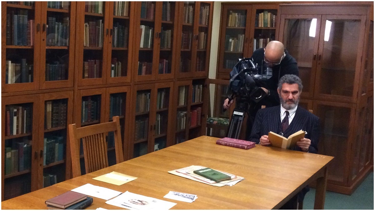  Mark Samuels Lasner sitting in a room surrounded by his collection (Shirley Min/WHYY) 