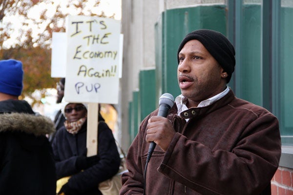 <p>Terrance Meacham of the Philadelphia Unemployment Project organizes protestors in front of Career Link on Spring Garden Street. (Emma Lee/for NewsWorks)</p>
