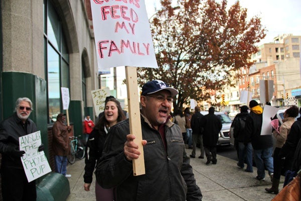 <p>Carmelo Del Valle, a heavy equipment operator from Olney, marches on Spring Garden Street with other unemployed people who want benefits extended. He has been unemployed for more than a year. (Emma Lee/for NewsWorks)</p>

