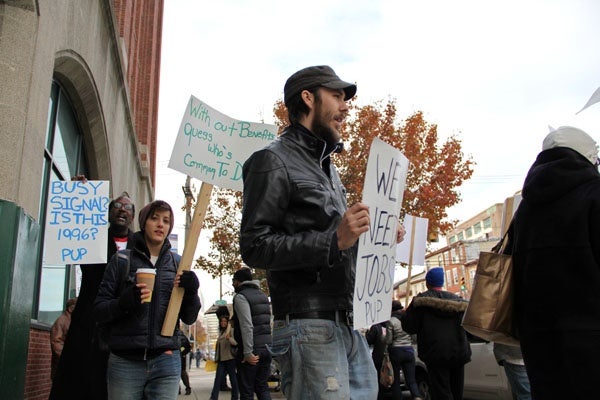 <p>About 30  people march in front of Career Link office on Spring Garden Street. The protestors called for an extension of unemployment benefits and expressed frustration with the unemployment call centers. (Emma Lee/for NewsWorks)</p>
