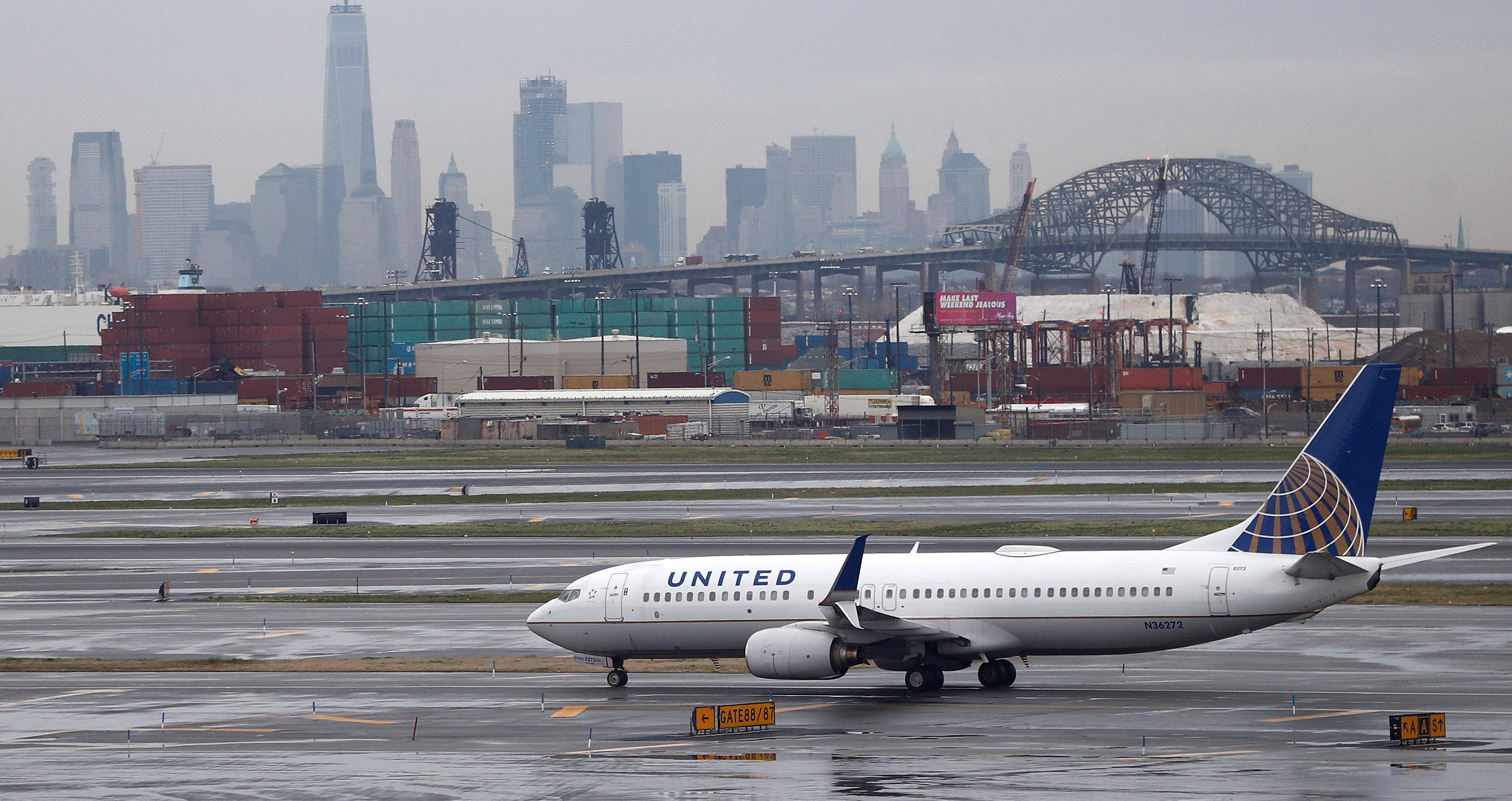 The New York City skyline gives backdrop to a United Airlines airplane taxing at Newark Liberty International Airport, Wednesday, April 12, 2017, in Newark, N.J. (AP Photo/Julio Cortez, file) 