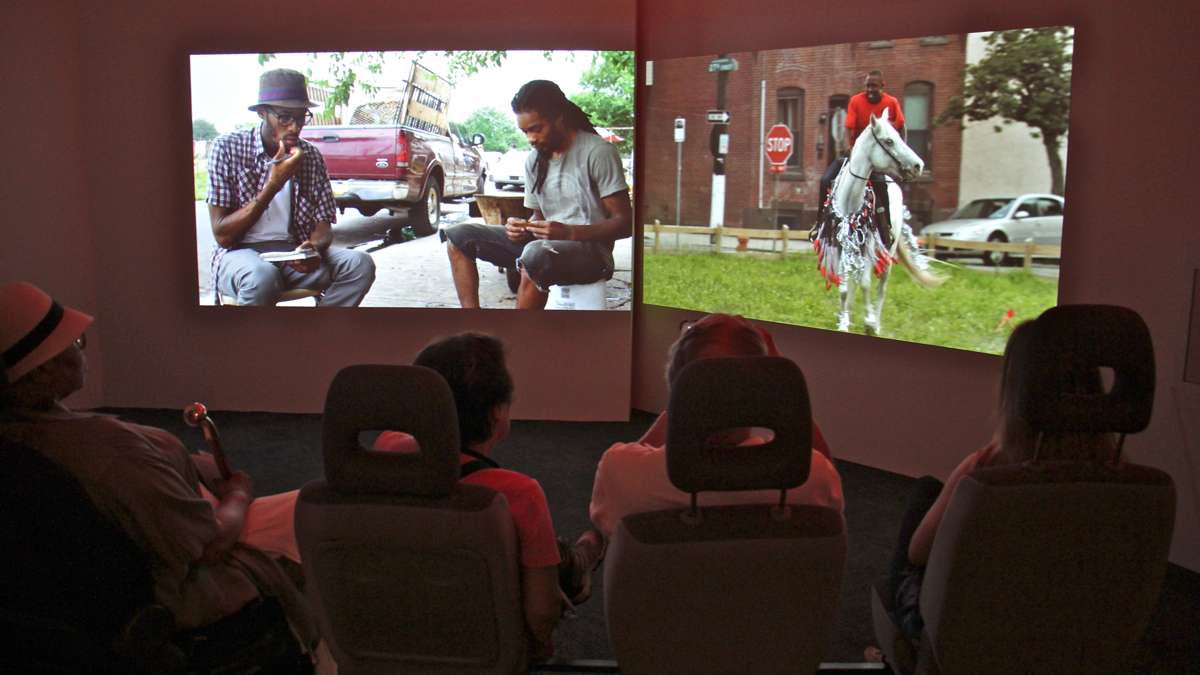 A 13-minute film, ''Horse Day,'' plays on two screens. Viewers sit in car seats.