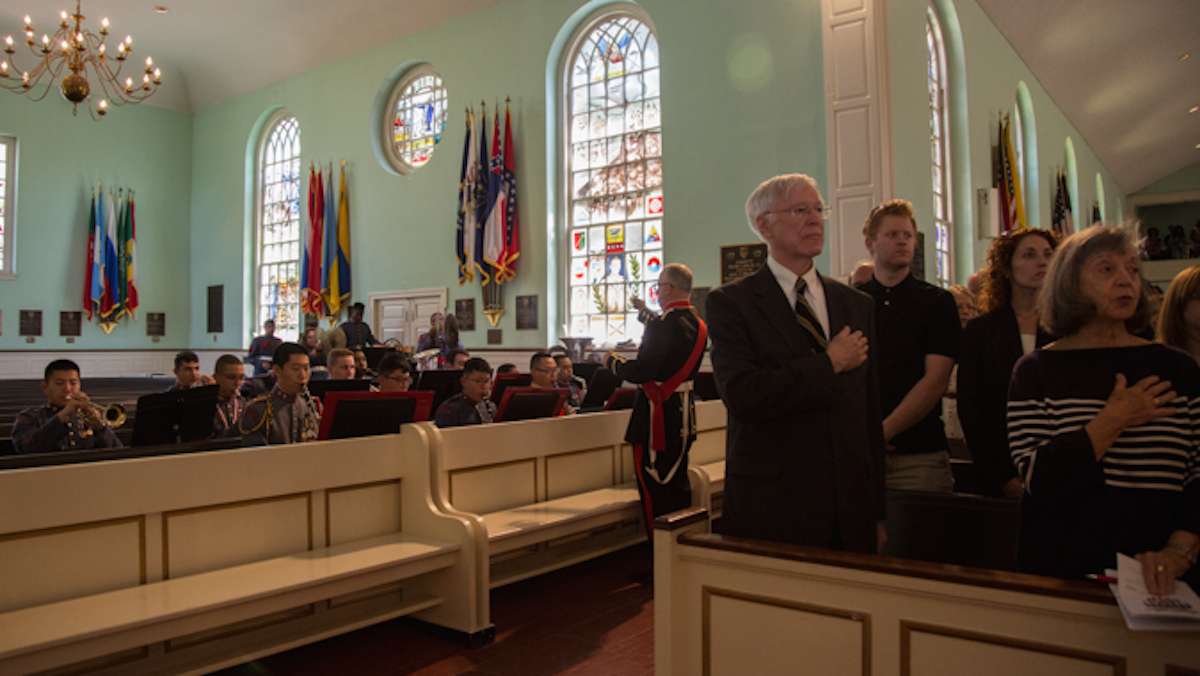 The Valley Forge Military College orchestra leads the chapel in the national anthem