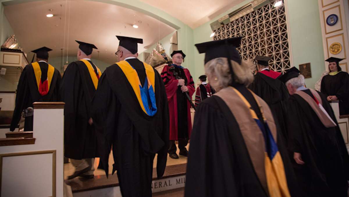 Professors at the Valley Forge MIlitary College proceed to their spots on the dais (