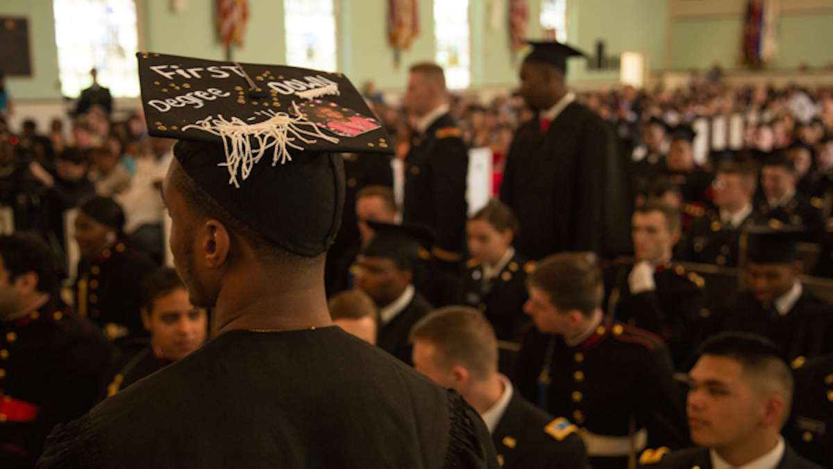 Diquan Gilbert stands with his decorated graduation cap during the 2016 Valley Forge Military College graduation, May 20, 2016.