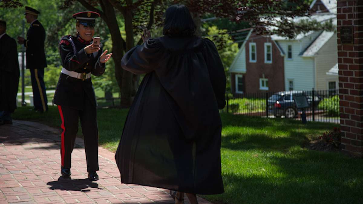 A cadet takes a playful video of a non-military classmate as they get ready for their graduation ceremony at the Valley Forge Military College, May 20, 2016.