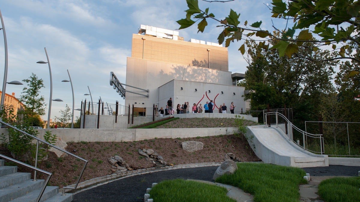 Manayunk residents and reporters attended a tour of the new Venice Island Performing Arts Center Wednesday evening. The exterior includes a rock garden and water play area.