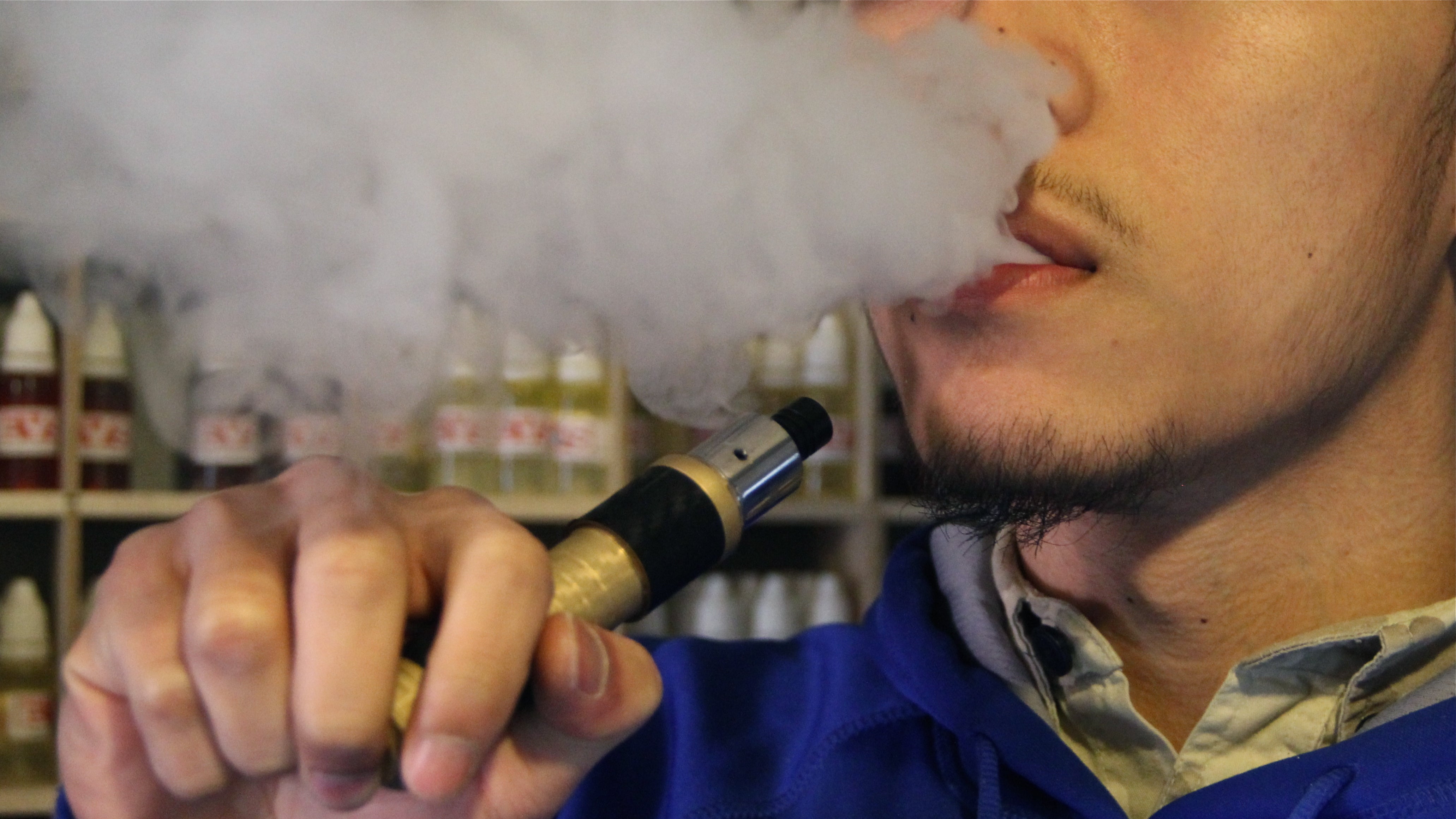  A new study finds that images of people vaping, such as found in commercials for e-cigarettes, cause former smokers to crave regular cigarettes. (Emma Lee/WHYY) 
