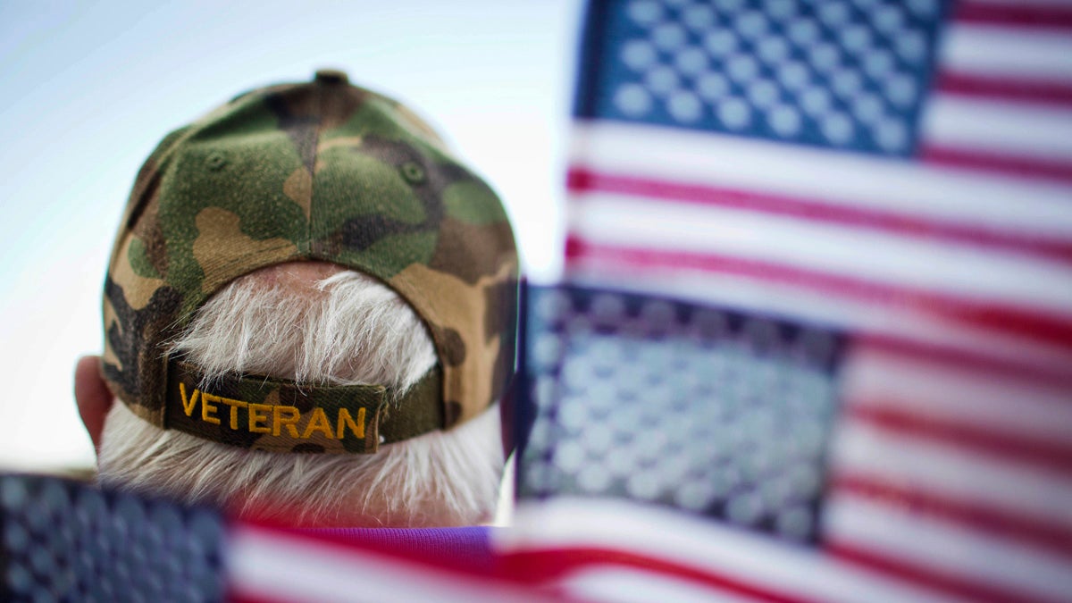  Frank Lindsey is surrounded by flags as he attends a 2014 Veterans Day parade in Montgomery, Ala. (AP Photo/Brynn Anderson) 