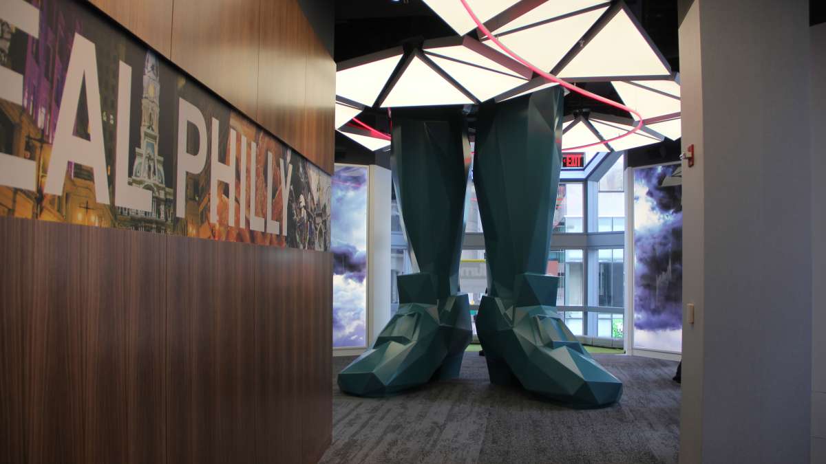 The journey to the observation deck at One Liberty Place begins on the second floor, where Ben Franklin's legs disappear into the ceiling.