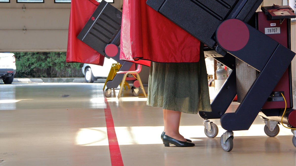 The feet of a woman at in a voting booth