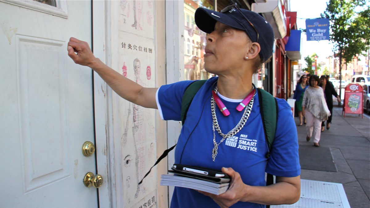  Josenia Allen knocks on doors on South Street trying to get the vote out and distributing literature about the American Civil Liberties Union's Campaign for Smart Justice. (Emma Lee/WHYY) 