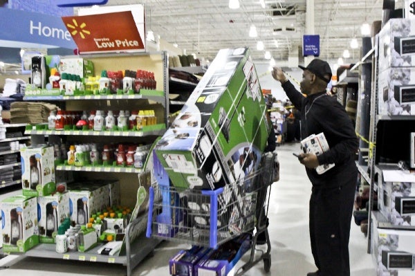 <p>Although Walmart has set up caution tape at the end of some aisles, employees help shoppers move easily through the rows. (Kimberly Paynter/for NewsWorks)</p>
