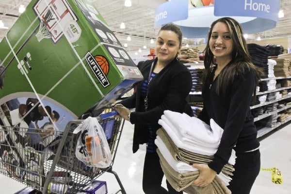 <p><p>Janira Sanchez and Cynthia Rivera purchase a basketball net for Sanchez's son, 9, and some $2 towels. (Kimberly Paynter/for NewsWorks)</p></p>
