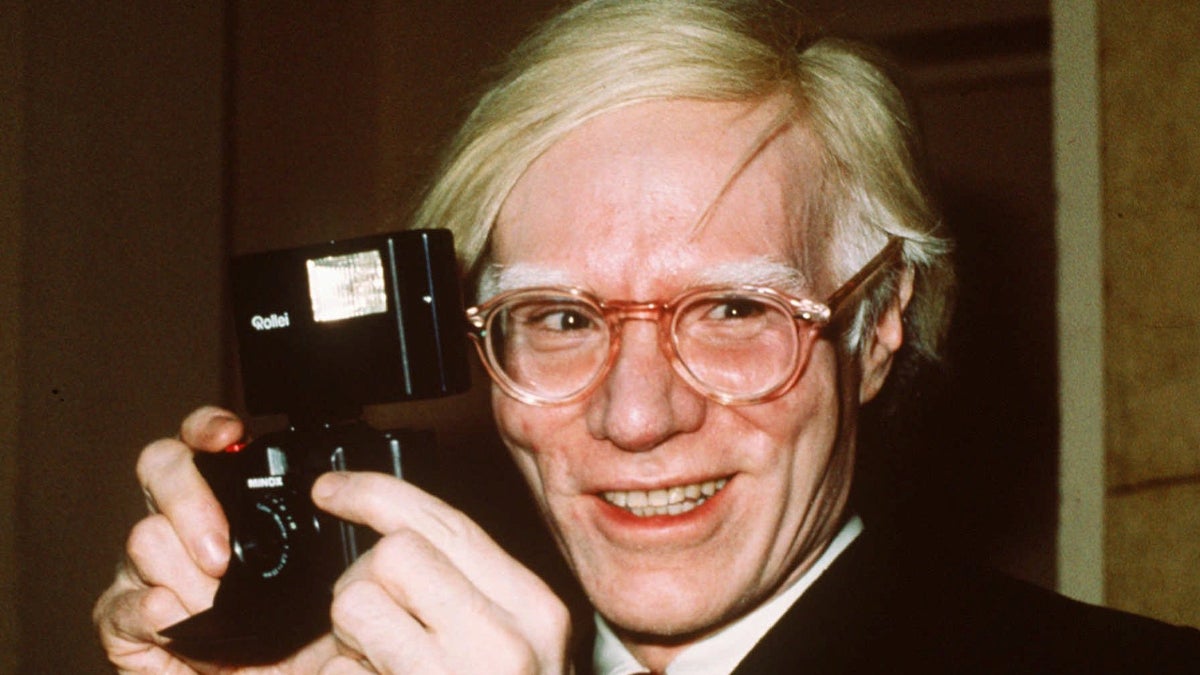  Pop artist Andy Warhol smiles in New York in this 1976 file photo. (AP Photo/Richard Drew, file) 