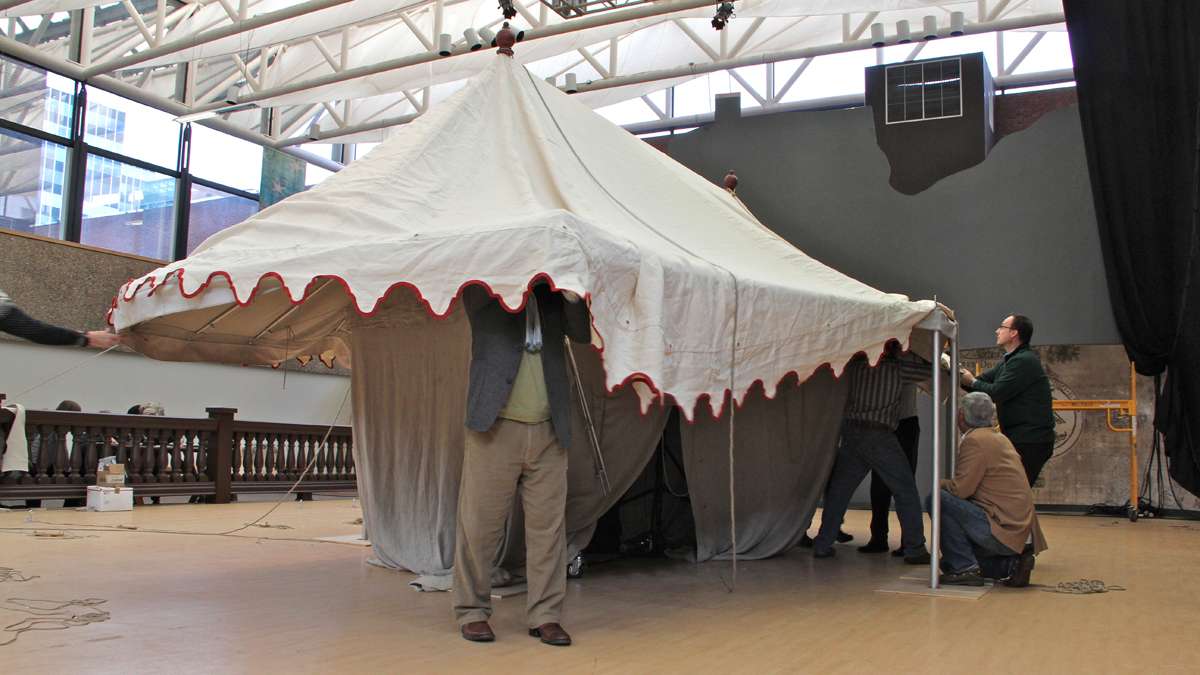 Workers assamble a replica of George Washington's command tent at the Museum of the American Revolution, in preparation for displaying the real thing. (Emma Lee/for NewsWorks)