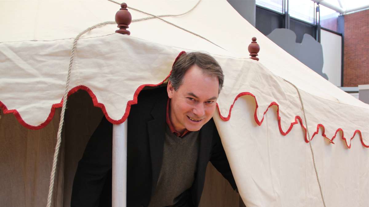 Museum of the American Revolution Project Director Scott Stephenson stoops under the entrance to a reproduction of George Washington's command tent. At 6-foot-4, Stephenson is just an inch taller than Washington was. (Emma Lee/for NewsWorks)