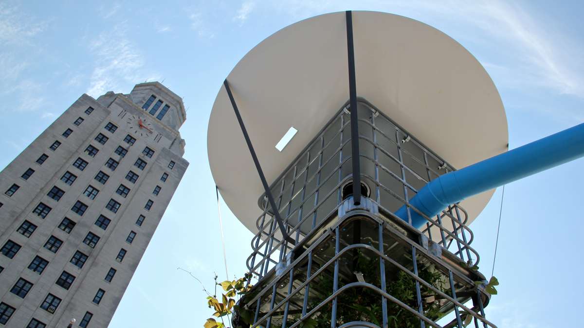 Rainwater collection towers feed into pipes that irrigate the plantings at Camden's new water themed park. (Emma Lee/WHYY)