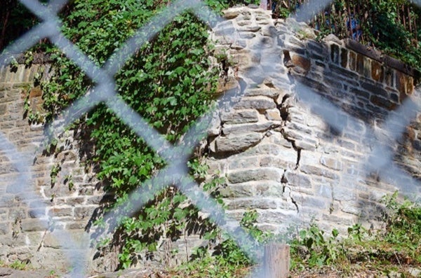 <p><p>East Falls residents have expressed concern about a crumbling wall on the busy Midvale Avenue. The School District, which owns the property, is having trouble finding the funds to pay for repairs. (Bas Slabbers/for NewsWorks)</p></p>
