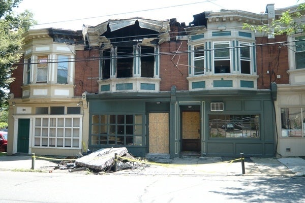 <p><p>The Black Olive building, shown here a day after the June 2011 fire, remains a neighborhood eyesore. (Alan Tu/WHYY)</p></p>
