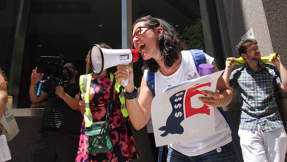  Xelba Gutierrez leads a protest march demanding that the Democratic National Convention reveal its sources of funding. (Emma Lee/WHYY) 
