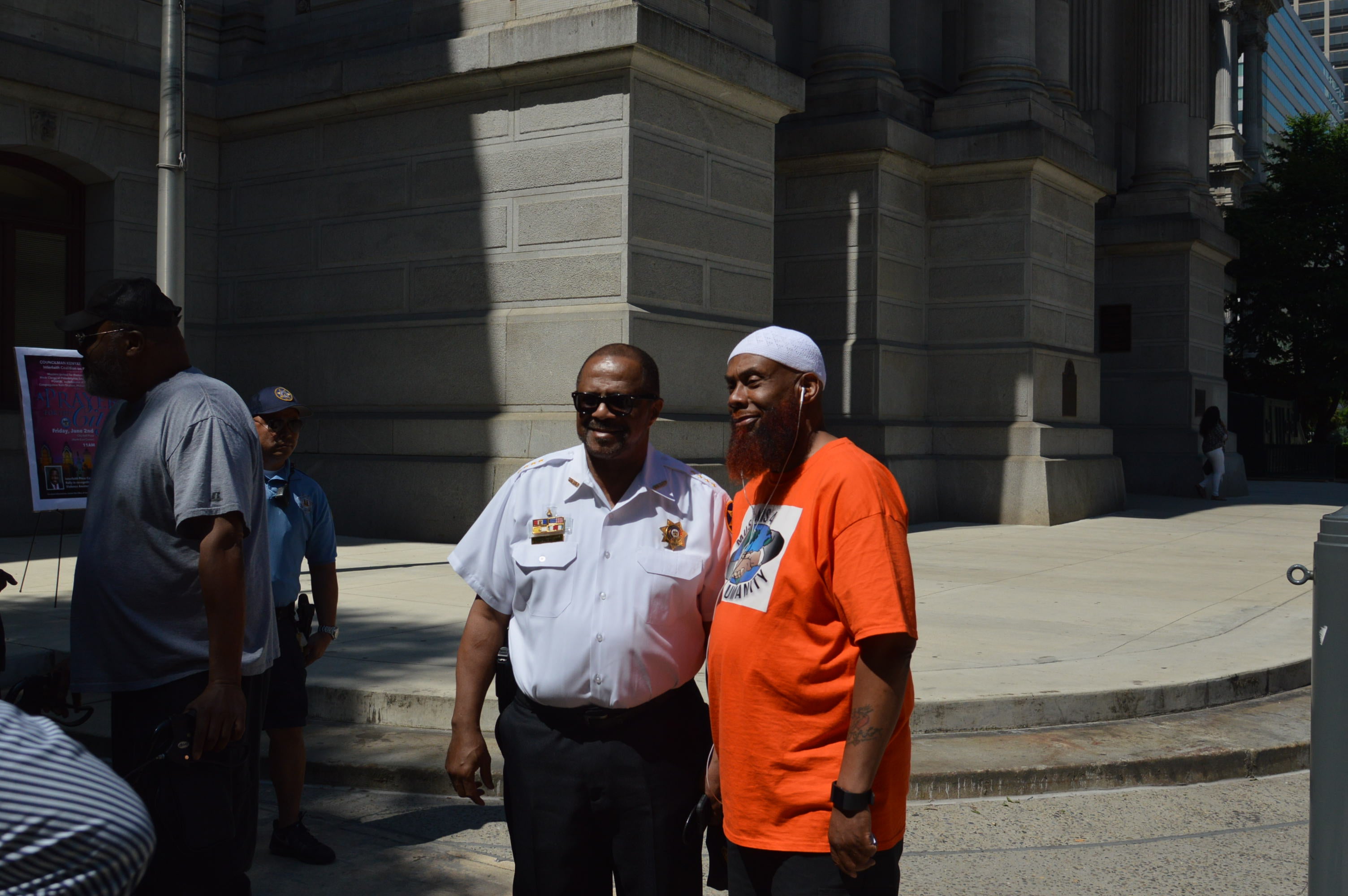  Sheriff Jewell Williams talks to one of those gathered to pray for an end of violence Philadelphia. (Tom MacDonald/WHYY) 