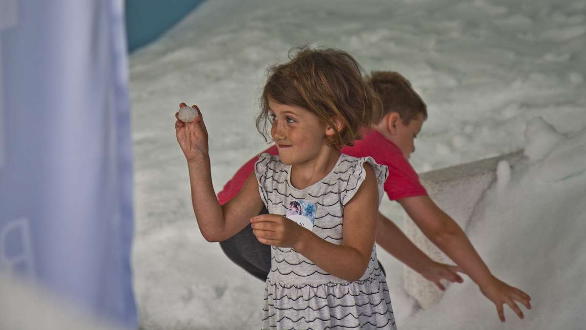 Molly Riordan, 5, makes a snowball.