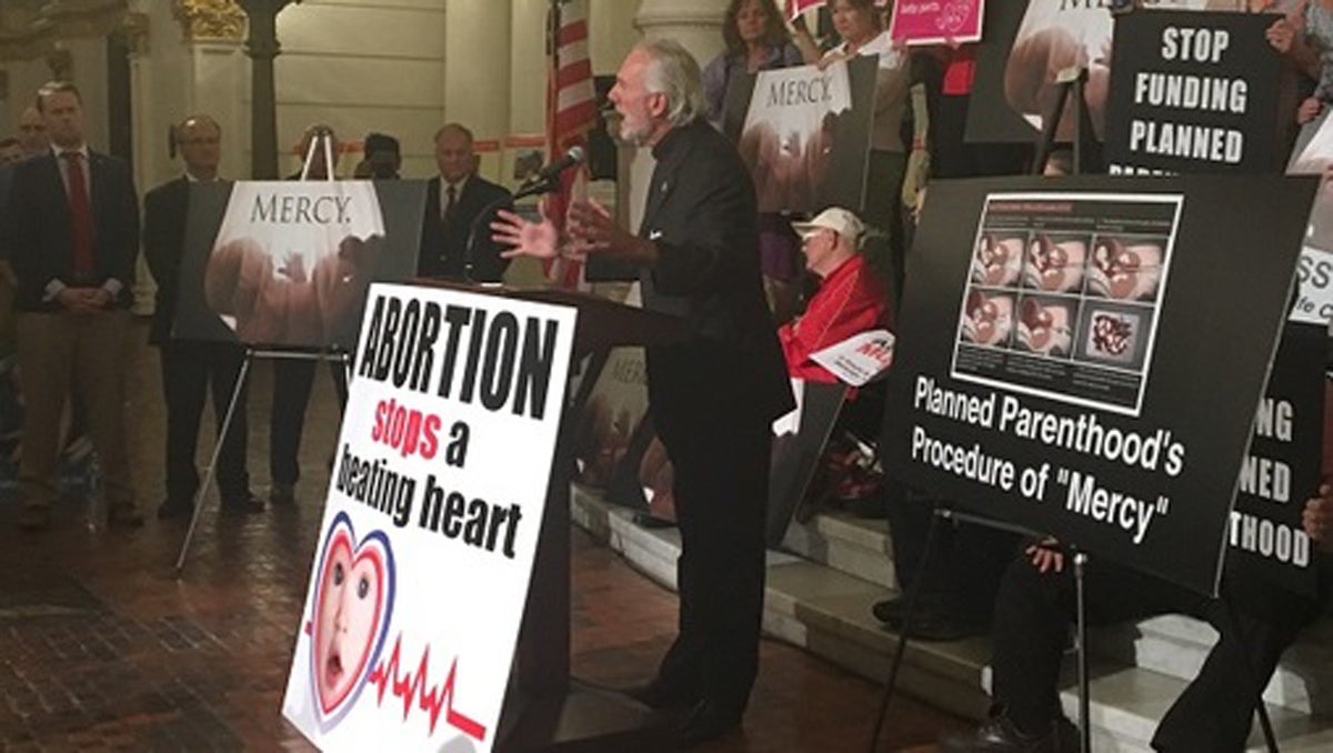  A pastor spoke to the crowd in the Capitol rotunda as the group pushed for anti-abortion bills. (AP Photo) 