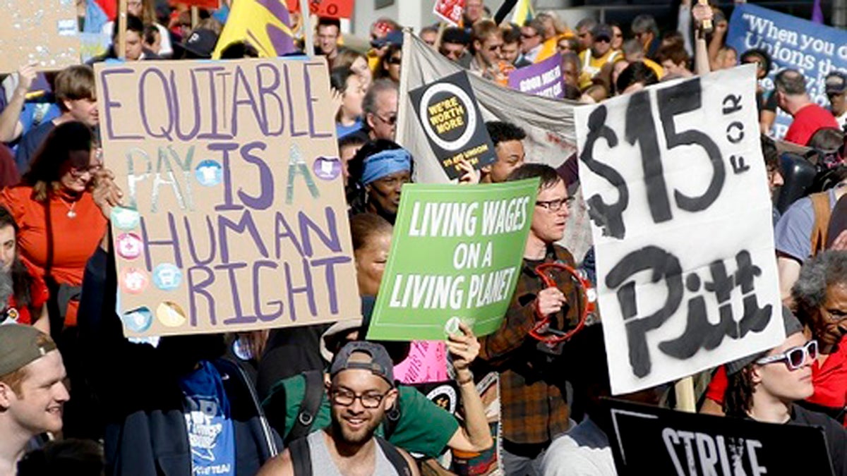  In this April 14, 2016, file photo, union organizers, students, and supporters for a $15 an hour wage march through the Oakland section Pittsburgh. (Keith Srakocic/AP Photo) 