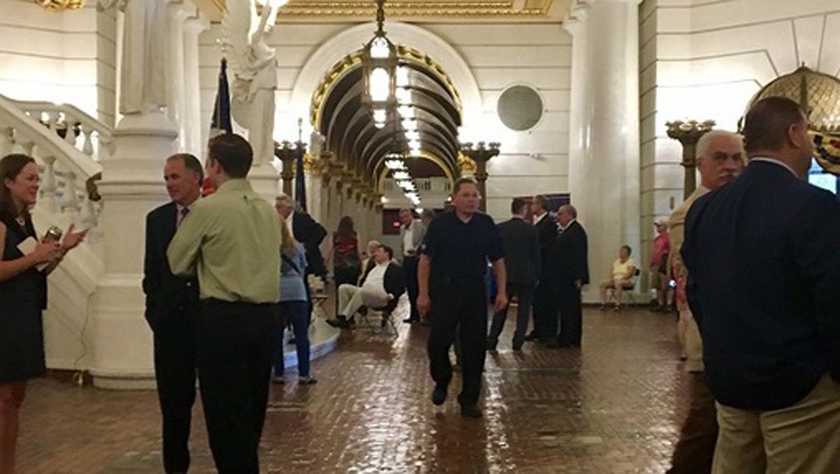  Lobbyists and lawmakers mill around the Capitol rotunda on an unusually busy Saturday. (Katie Meyer/WITF) 