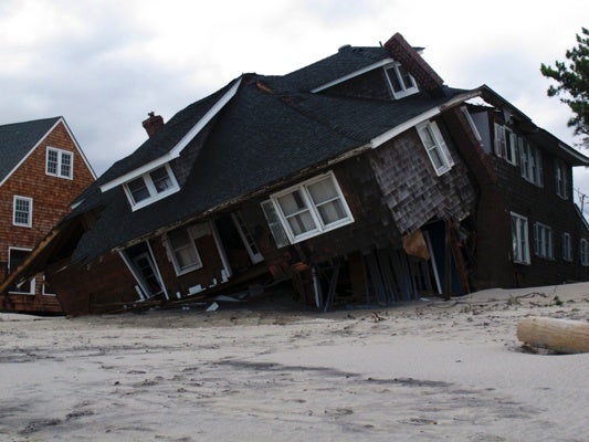<p>An oceanfront home is destroyed in Mantoloking, N.J., on Oct. 31, 2012. Sandy, the storm that made landfall Monday, caused multiple fatalities, halted mass transit and cut power to more than 6 million homes and businesses. (AP Photo/Wayne Parry)</p>
