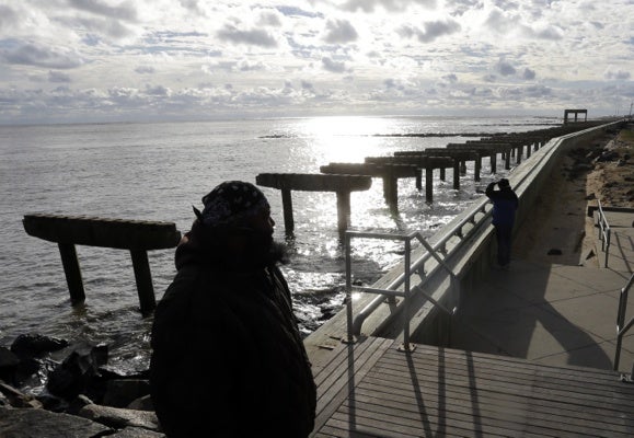 <p><p>Lamar Stevens, bottom left, looks out at a boardwalk that was destroyed by superstorm Sandy in Atlantic City, N.J., Wednesday, Oct. 31, 2012. (AP Photo/Patrick Semansky)</p></p>
