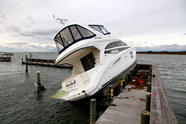 <p><p>This is boat washed onto at dock by superstorm Sandy in Ship Bottom on Long Beach Island, N.J. on Thursday, Nov. 1, 2012. (AP Photo/Robert Ray)</p></p>
