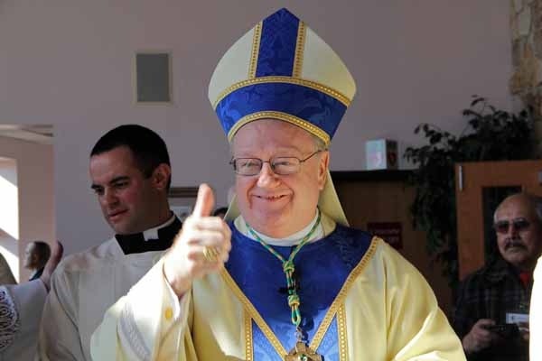 <p>Bishop Dennis J. Sullivan, newly installed Bishop of the Diocese of Camden, gives a thumbs up in the lobby of St. Agnes Church. (Emma Lee/for NewsWorks)</p>
