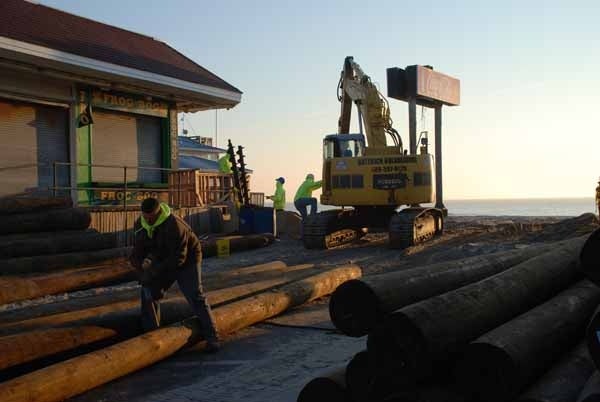 <p><p><span style="font-family: Verdana; font-size: small;">Work crews ready some of the estimated 2000 piles that will support Seaside Heights' new boardwalk. (Sandy Levine/for NewsWorks)</span></p></p>
